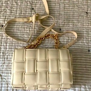 Cream colored crossbody bag with gold chain